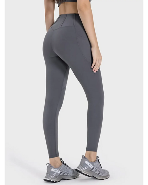 active leggings with pockets in gray by Trendsi, shown from the back with a high waist and athletic fit