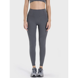 women's active leggings with pockets in dark gray worn with athletic shoes