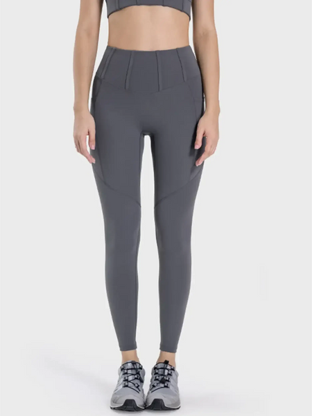women's active leggings with pockets in dark gray worn with athletic shoes