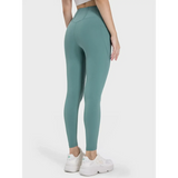 Trendsi women's active leggings with pockets in teal shown from the back with high waist fit