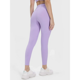 Trendsi women's active leggings with pockets in lavender shown from the back on a model