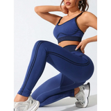 Trendsi women's athletic cami leggings set in blue with black trim worn with white sneakers