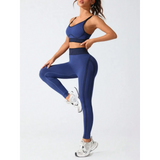 Trendsi women's athletic cami leggings set in blue with black accents worn with white sneakers