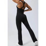 Babe Beachwear women's athletic crisscross jumpsuit in black with flared legs and supportive straps