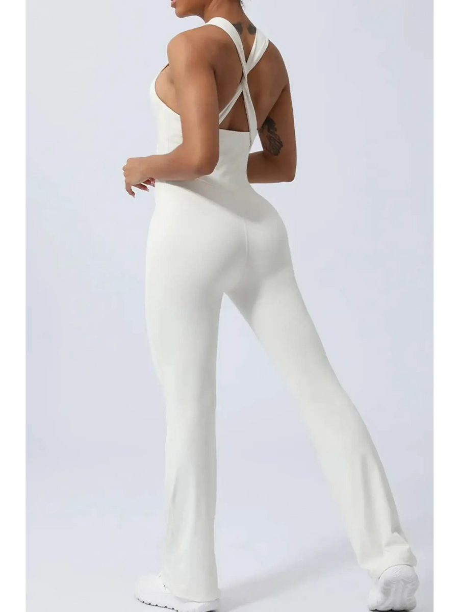 Babe Beachwear women's athletic crisscross jumpsuit in white with fitted silhouette and flared legs