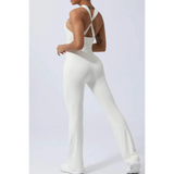 Babe Beachwear women's athletic crisscross jumpsuit in white with fitted silhouette and flared legs