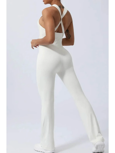 Babe Beachwear women's athletic crisscross jumpsuit in white with fitted silhouette and flared legs