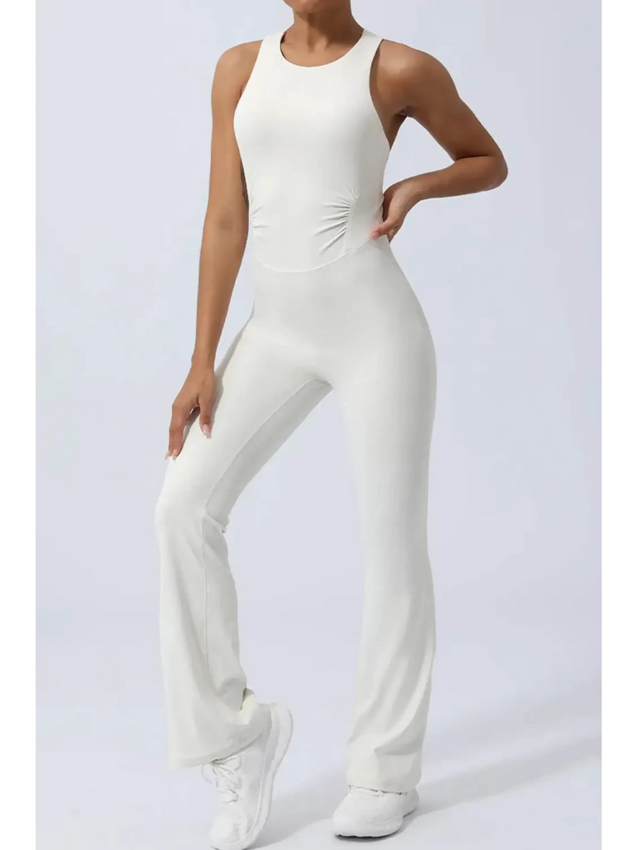 Babe Beachwear women's athletic crisscross jumpsuit in white, sleeveless activewear with fitted waist and flared legs