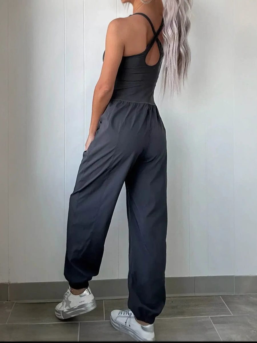 Trendsi women's beach jumpsuit in black with crisscross back and relaxed fit pants