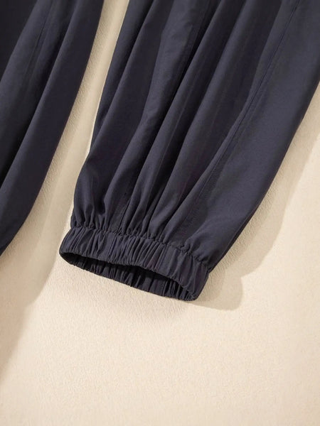 Close-up of black elastic cuff detail on women's beach jumpsuit by Trendsi