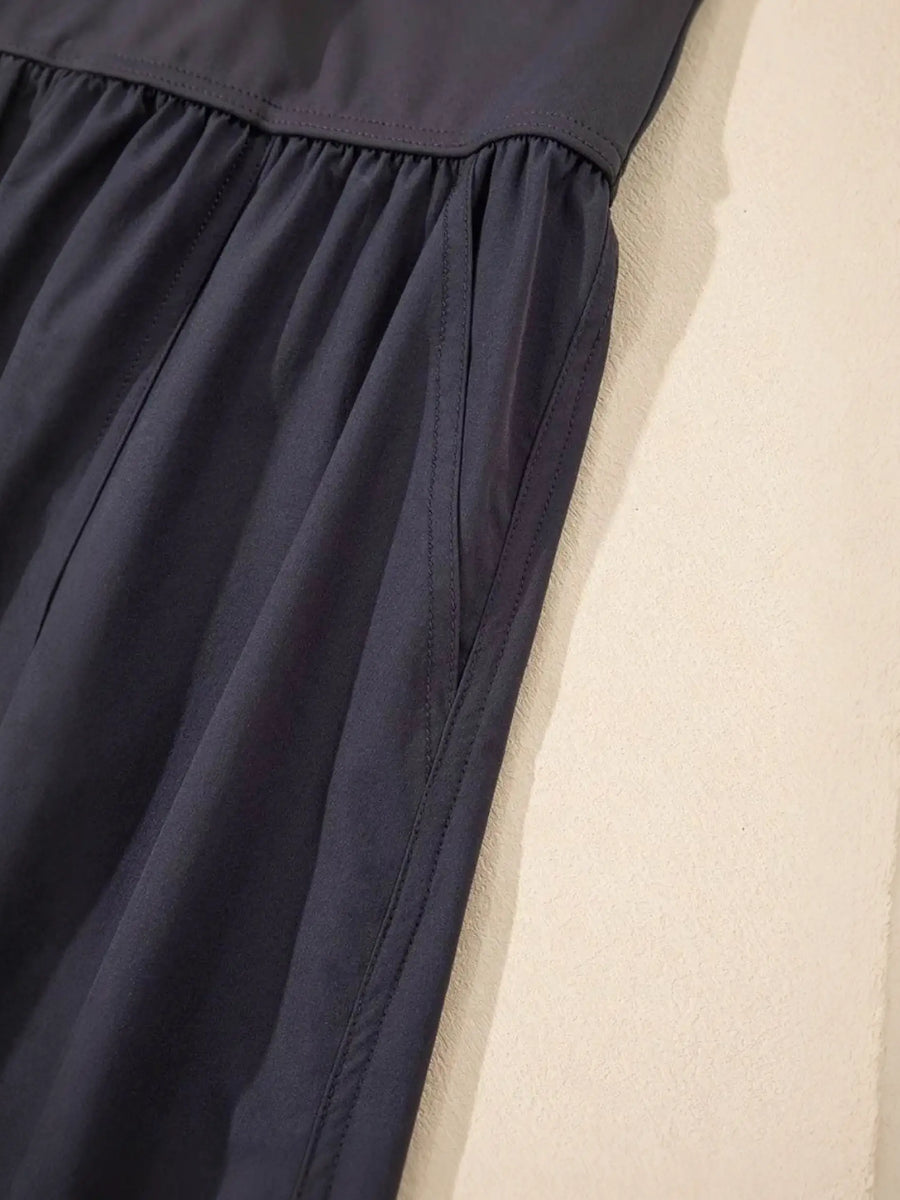 Close-up of black Trendsi women's beach jumpsuit showing fabric texture and stitching details
