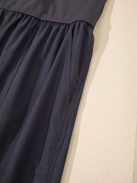 Close-up of black Trendsi women's beach jumpsuit showing fabric texture and stitching details