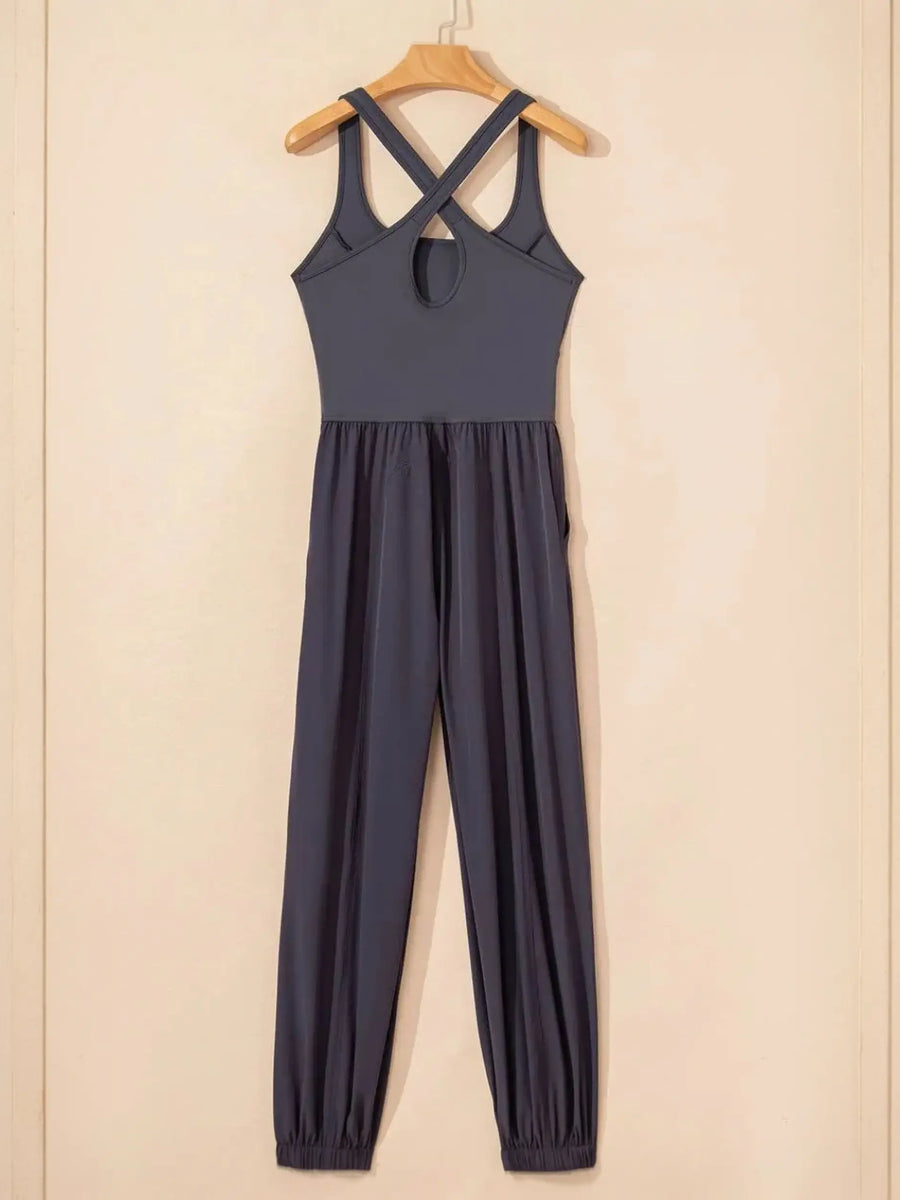 Trendsi women's beach jumpsuit in dark fabric with crisscross back straps and elastic ankle cuffs