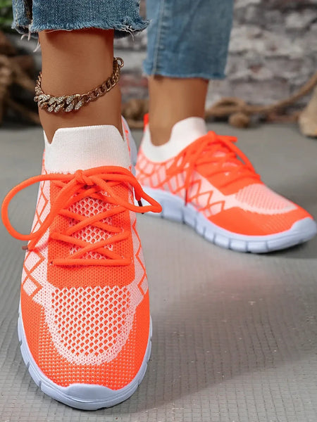 Trendsi women's breathable beach sneakers in bright orange with white soles and knit design