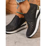 Trendsi women's breathable wedge sneakers in black with perforated design and white sole
