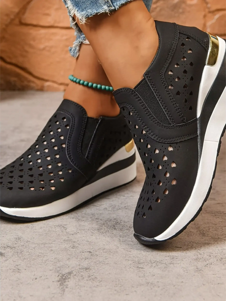 Trendsi women's breathable wedge sneakers in black with perforated design and white sole