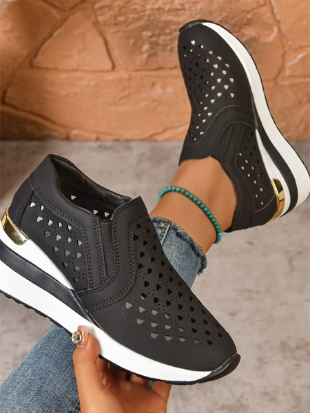 Trendsi women's breathable wedge sneakers in black with heart-shaped cutouts and white sole