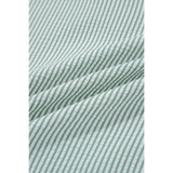 Close-up of green and white striped fabric of women's casual sleeveless shirt by Babe Beachwaer