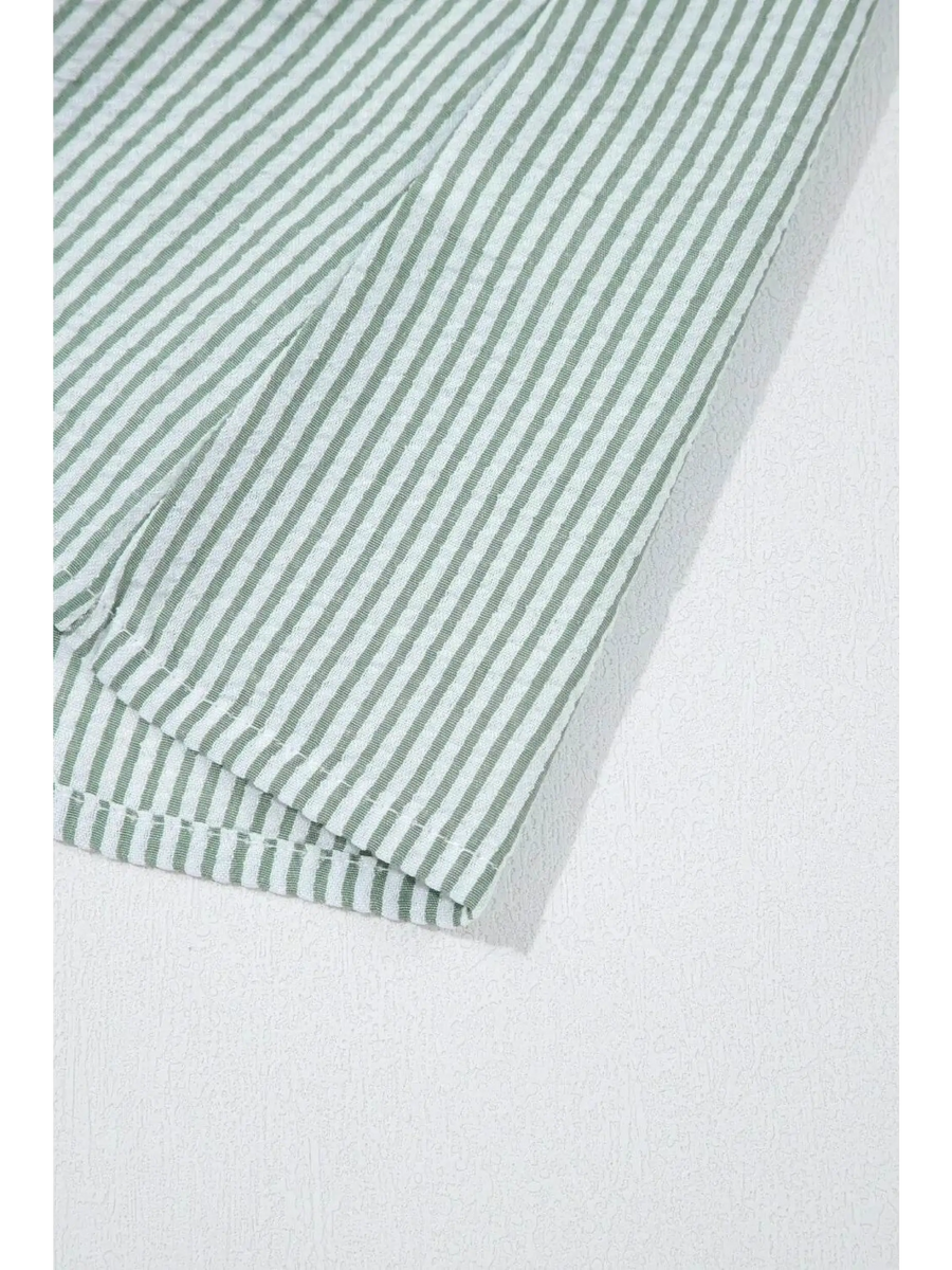 Close-up of Babe Beachwear women's casual sleeveless shirt with green and white vertical stripes