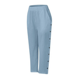 Babe Beachwear light blue pants with side buttons, styled for women's casual white vacation pants