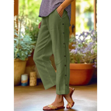 Babe Beachwear women's casual white vacation pants styled in green with button details on the side