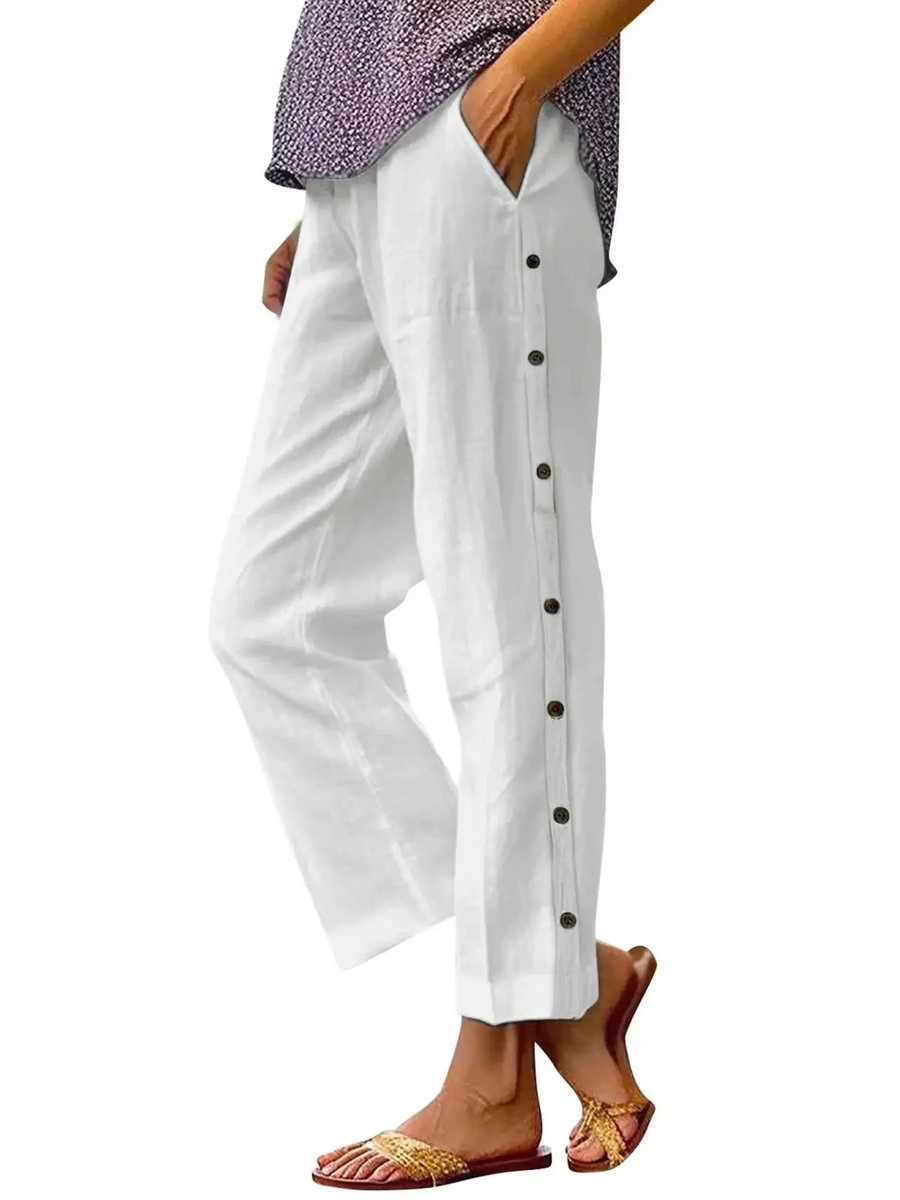 side view Babe Beachwear women's casual white vacation pants with side button details and relaxed fit
