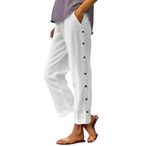 side view Babe Beachwear women's casual white vacation pants with side button details and relaxed fit