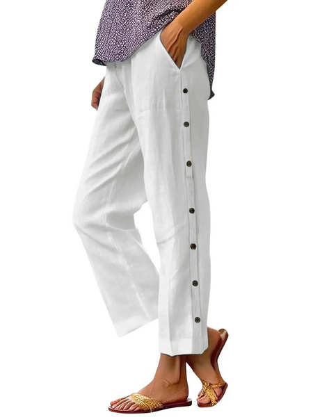 side view Babe Beachwear women's casual white vacation pants with side button details and relaxed fit