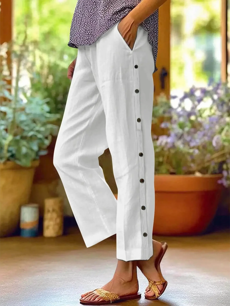 woman wearing Babe Beachwear women's casual white vacation pants with side buttons and relaxed fit