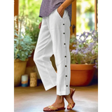 woman wearing Babe Beachwear women's casual white vacation pants with side buttons and relaxed fit
