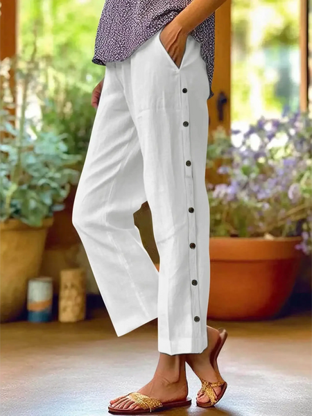 woman wearing Babe Beachwear women's casual white vacation pants with side buttons and relaxed fit
