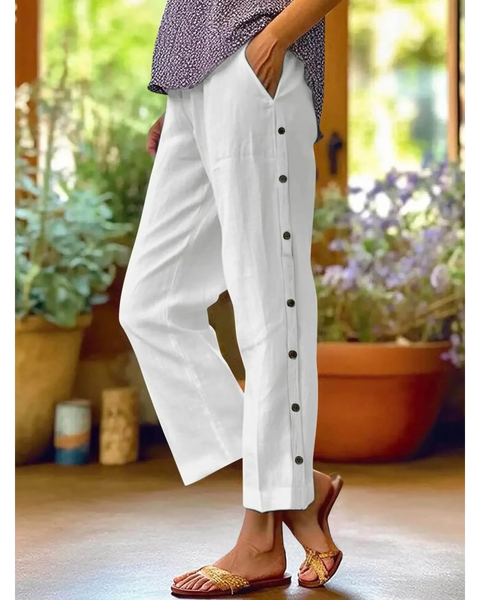 woman wearing Babe Beachwear women's casual white vacation pants with side buttons and relaxed fit