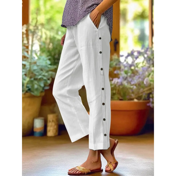 woman wearing Babe Beachwear women's casual white vacation pants with side buttons and relaxed fit