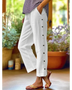 woman wearing Babe Beachwear women's casual white vacation pants with side buttons and relaxed fit