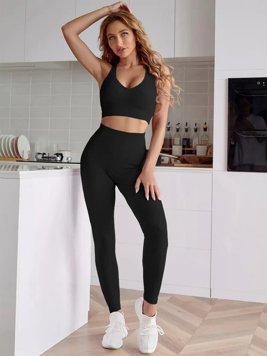 woman wearing black Trendsi women's compression leggings set in black with high waist and matching sports bra