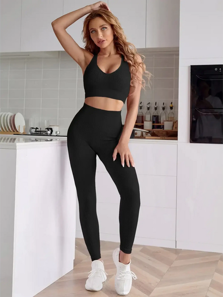 woman wearing black Trendsi women's compression leggings set in black with high waist and matching sports bra