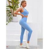 Trendsi women's compression leggings set in light blue with a matching crop top and white sneakers