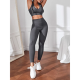 Dark grey Trendsi women's compression leggings set in dark gray with matching sports bra and white sneakers