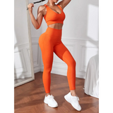 Trendsi women's compression leggings set in bright orange with matching sports bra and white sneakers
