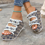 Babe Beachwear women's double buckle sandals with patterned fabric and white trim on worn feet