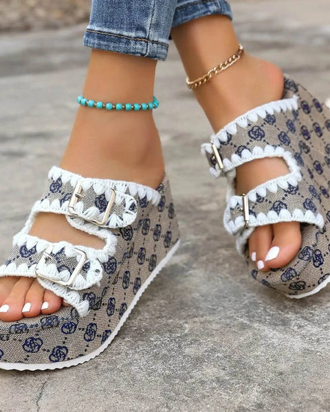 Babe Beachwear women's double buckle sandals with patterned fabric and white trim on worn feet