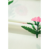 Close-up of floral fabric print with green leaves and pink flowers for women's flutter sleeve vacation dress