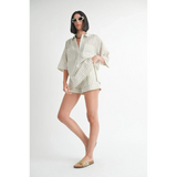 Emory Park women's linen shorts with matching striped oversized shirt and sunglasses