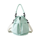 Trendsi light green women's nylon bucket bag with drawstring closure and white adjustable shoulder strap