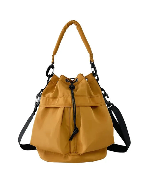 Trendsi women's nylon bucket bag in mustard yellow with adjustable shoulder and handle straps