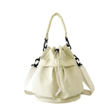 Trendsi women's nylon bucket bag in cream color with adjustable straps and drawstring closure