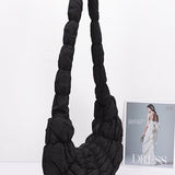 Babe Beachwaer black women's puffer hobo bag with quilted texture and long padded strap
