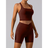 Babe Beachwear women's racerback crop top active tank in dark brown modeled with matching shorts