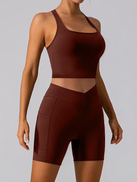 Babe Beachwear women's racerback crop top active tank in dark brown modeled with matching shorts