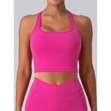 Babe Beachwear bright pink women's racerback crop top active tank worn by model